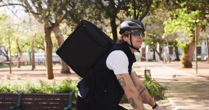 Man, bicycle and courier service with backpack in park for travel, package or parcel transportation. Male person, commute or outdoor ride with bike, helmet or bag for eco friendly delivery in nature