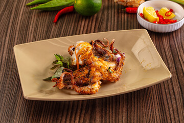 Gourmet grilled whole octopus served lime