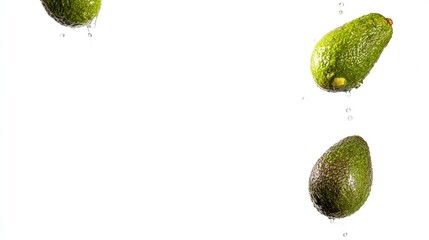 Avocado falling down isolated on white background.