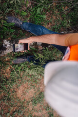 Naklejka premium Surveyor taking pictures of vegetation with smartphone