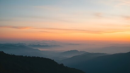 Obraz premium Misty Mountain Layers at Sunrise