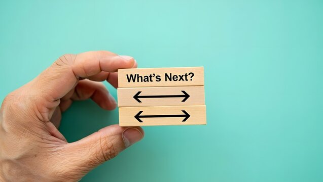 What's next?, business concept. Next step of work, plan, strategies, vision, project implementation, new opportunities and execution. Putting wooden cubes with What's next? 