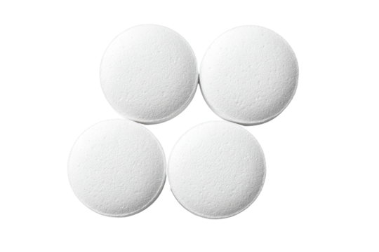 Four white round pills arranged in a symmetrical pattern