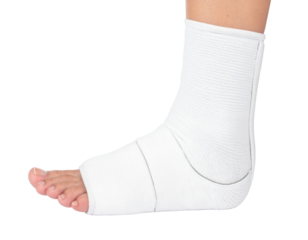 A wrapped ankle with a white bandage, showcasing the foot and lower leg in a supportive, healing position.