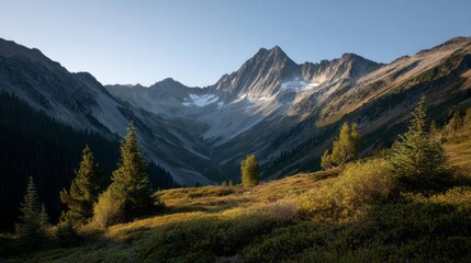 Fototapeta premium Sunlit alpine peaks embrace a lush valley at dawn, evoking Earth Day serenity and the mysterious Yule nature spirits