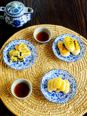 Group of fresh milk mooncakes (Chinese pastry dessert) with tea