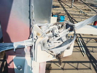 Damaged electrical junction box, from high temperature or short circuit, under sunlight.