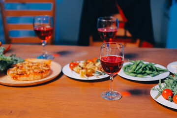 Joyful office Halloween party with coworkers in costumes, celebrating with drinks and laughter, fostering teamwork and festive spirit