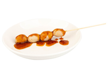 Thai meatballs with dipping sauce on white plate isolated on white background