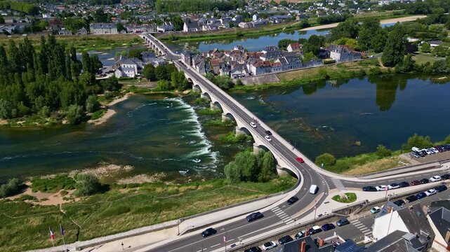 Pont Mar&eacute;chal Leclerc bridge with traffic crossing Loire river in historic town of Amboise, Loire Valley, France. Aerial drone forward