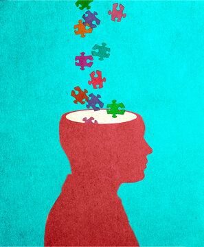 Colorful puzzle pieces entering a human head representing creativity