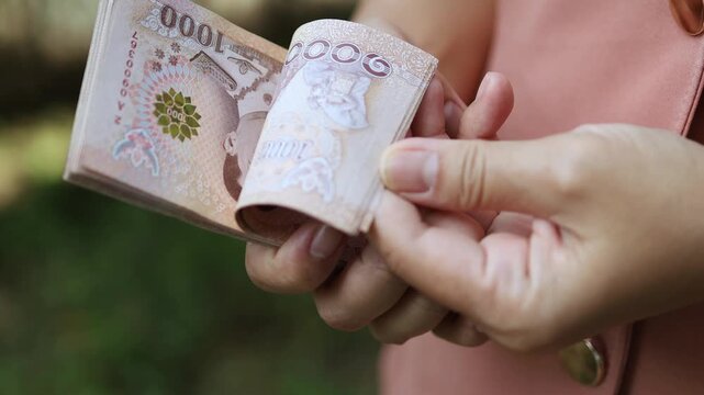 Thai Baht Money Count, Close-up Thai Baht Banknotes in Hand, Business hands Counting Money, Money and financial concepts