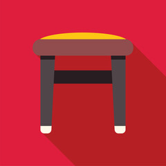 Round stool with yellow padding and dark wooden legs on a red background, perfect for interior design or furniture concepts