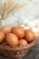Raw chicken eggs and towel on counter, closeup