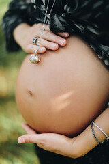 pregnant woman holding her belly
