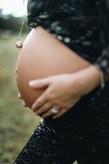 pregnant woman holding her belly
