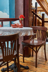 Cozy and romantic table setting in a rustic vintage cafe.