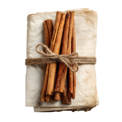 Cinnamon sticks tied with twine on aged paper
