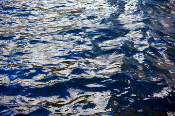 Glittering sea surface under bright sunlight.
