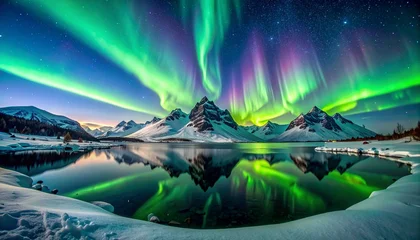 Wanddecoratie Reflectie Aurora borealis glowing over snow-covered mountains, reflected in a frozen lake  © Upnesh