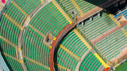 Aerial view of the green and empty seats of the Palermo stadium, in Sicily, Italy.