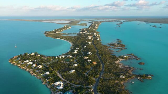 Golden hour aerial view of a luxury residential islan in the Bahamas.