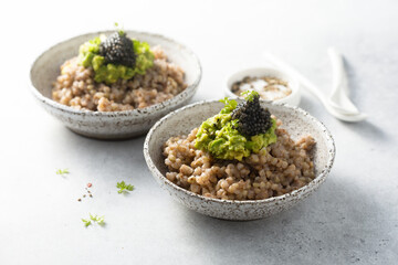 Green buckwheat with avocado and caviar
