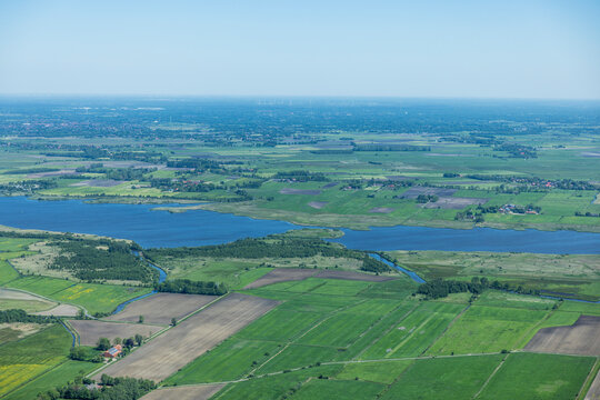 Aerial landscape of rural lake area and farm land in western Denmark.