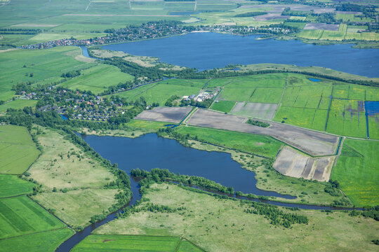 Aerial landscape of rural lake area and farm land in western Denmark.