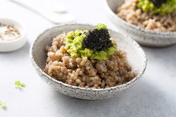 Green buckwheat with avocado and caviar