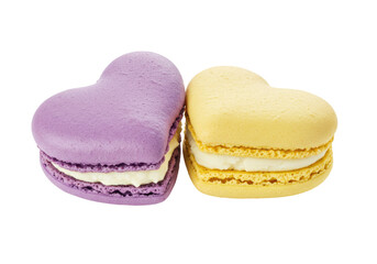 Isolated heart-shaped macarons, pastel sweets, two cookies, a purple one and a yellow one