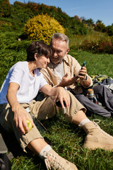 Active seniors enjoying a joyful break while hiking in nature