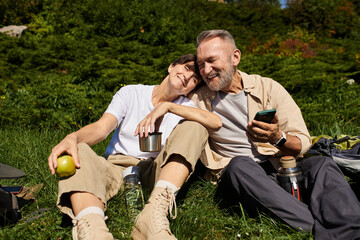Active seniors enjoying nature's beauty while hiking together in the mountains