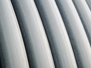 Close-up of coiled black pipes