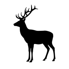 A silhouette standing red deer stag with large antlers.