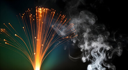 A vibrant fiber optic display with orange glowing tips juxtaposed against wisps of white smoke on black