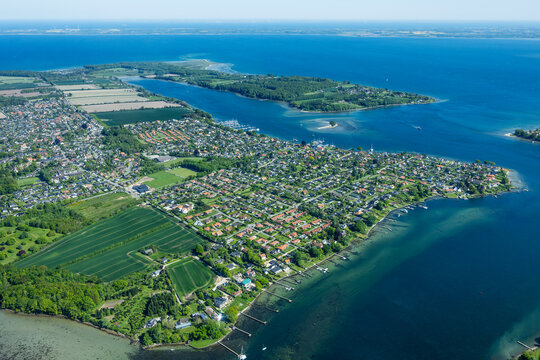 Aerial landscape view of islands and coast line with green fields and blue waters in the Baltic Sea. Near Svendborg, Denmark