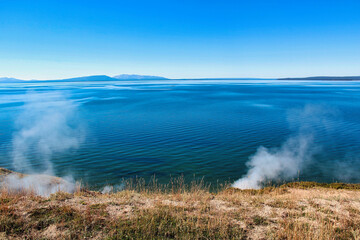 Steam Rising from Geothermal Vents on the Shore of Yellowstone Lake at Steamboat Point, Yellowstone National Park in Wyoming.