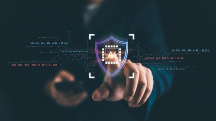 Cybersecurity concept with AI technology protection. Businessman touching virtual shield icon with artificial intelligence chip symbol, representing data security, privacy, and digital defense