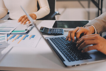 Fototapeta premium Accounting company provide finance and taxation planning for profitable cash flow, Auditor and accountant team working in office, analyze financial data and accounting record with calculator.Insight