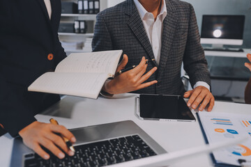 Obraz premium Accounting company provide finance and taxation planning for profitable cash flow, Auditor and accountant team working in office, analyze financial data and accounting record with calculator.Insight