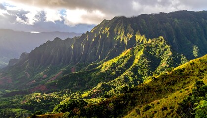 Panoramic view of lush, sunlit mountain range with deep green valleys and scattered clouds. Hills roll into the distance