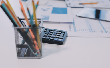 Accounting company provide finance and taxation planning for profitable cash flow, Auditor and accountant team working in office, analyze financial data and accounting record with calculator.Insight