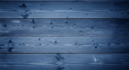 A deep blue textured background of weathered horizontal wooden planks. The rustic surface shows prominent wood grain and knots, creating an authentic, tactile feel. Ideal for design projects, product 