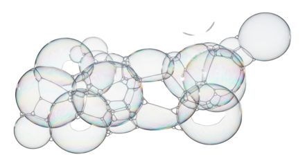Clear, iridescent soap bubbles clustered in various sizes against a stark black background