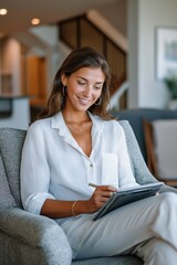 Obraz premium Young caucasian woman relaxed at home using digital tablet in living room