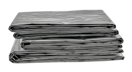 Three neatly stacked, folded, crinkled gray sheets of plastic or tarp material