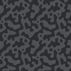 Vector seamless pattern. Free form organic shapes. Stylish structure of natural dotted spots. Hand drawn abstract background. Can be used as swatch in Illustrator. Monochrome confused print.