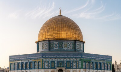 Close-up of a magnificent golden dome on an octagonal building with colorful tiles