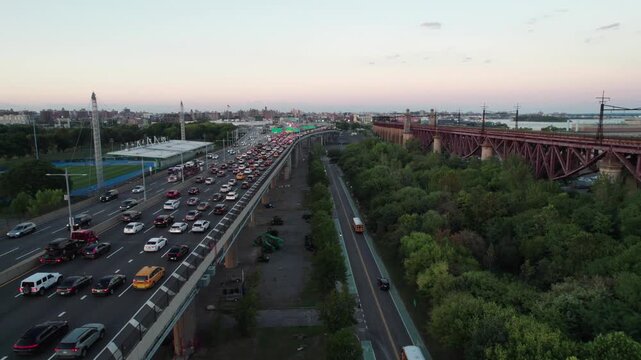Randalls Island, NYC, with traffic on the Triboro Bridge Expressay, 4K aerial.